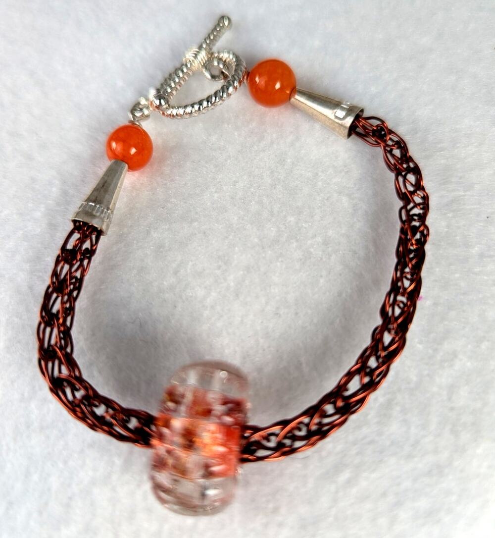 Handmade glass bead on a handmade viking woven chain bracelet with Toggle7"